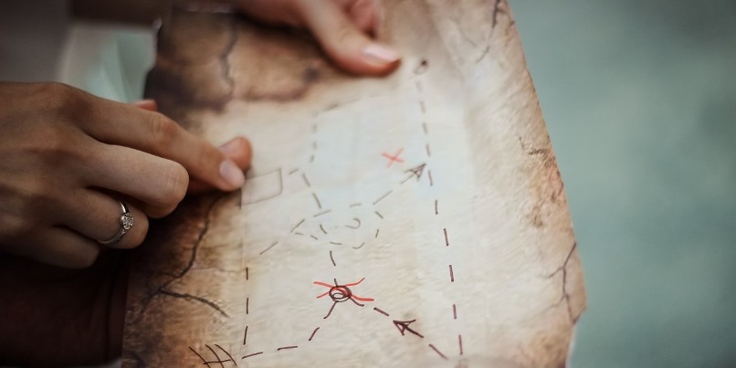 Woman pointing on a map with her fingers