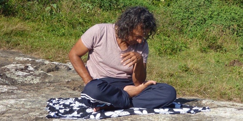 Man practicing Thai Self-Massage