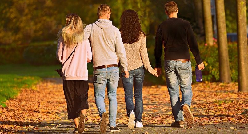 Friends walking in the forest