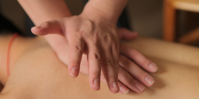 Hands on body, giving massage therapy