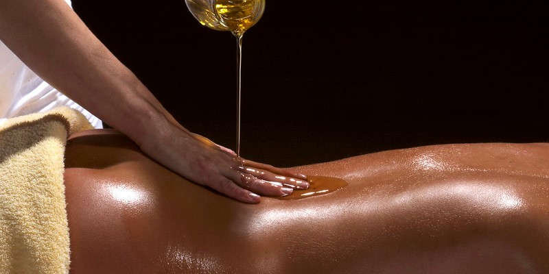 Woman giving Ayurvedic oil massage