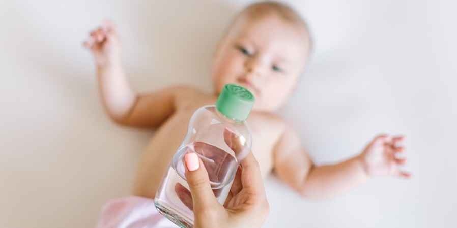 Baby about to having a massage with oil