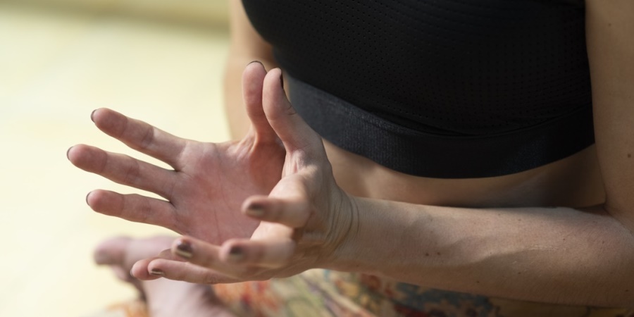 Woman doing mudra in Yoga