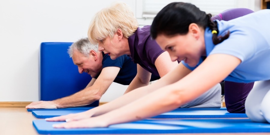 People doing a Yoga class