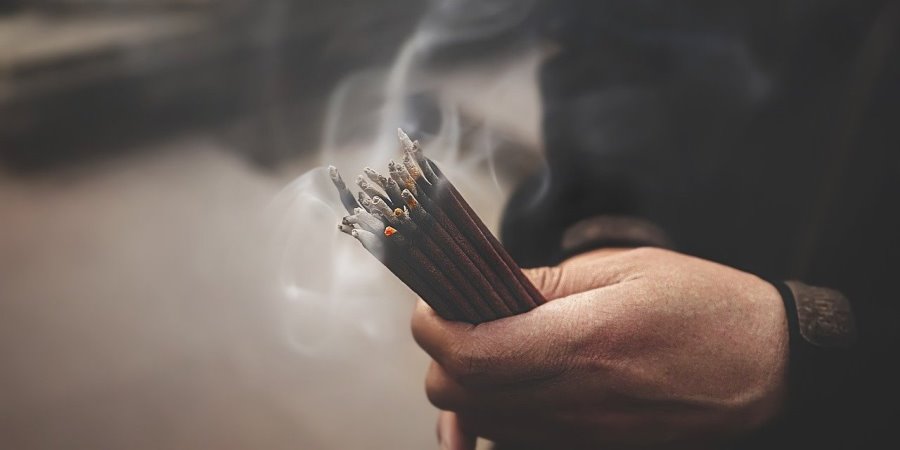 Person burning incense