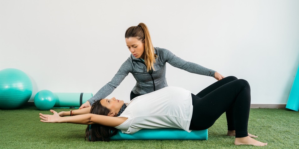 Doula working with pregnant woman