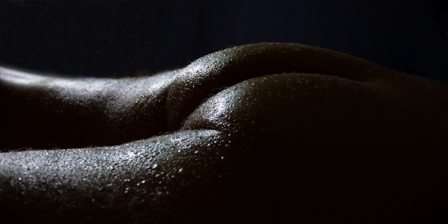 Nude man receiving massage
