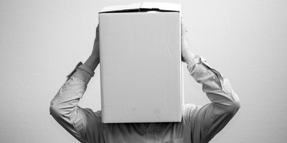 Man with his head in a box