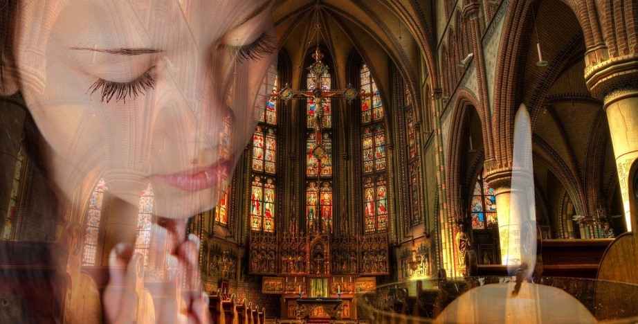 Woman praying in a church