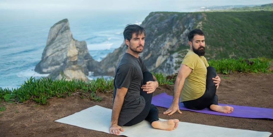 Two men doing Yin Yoga pose