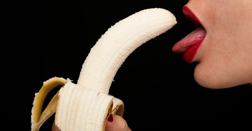 Woman eating banana