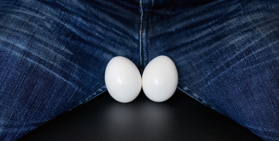 Man sitting with two eggs