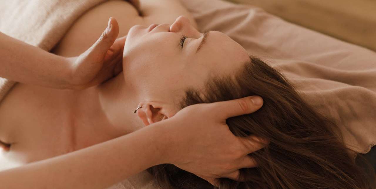 Woman massaging other woman