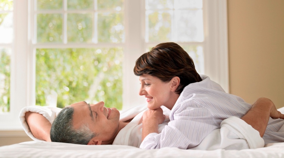 Couple being intimate in bed