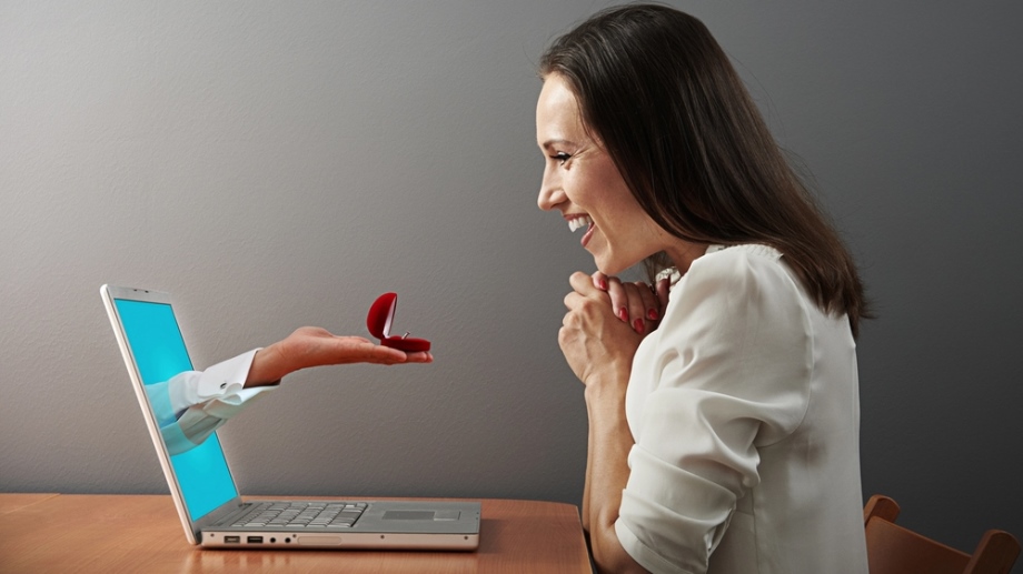 Woman behind computer using online dating website