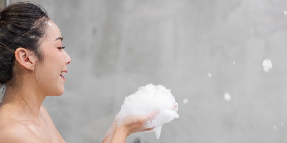 Soapy Massage in Bangkok | Treatment Service Providers Asian woman blowing soap bubbles