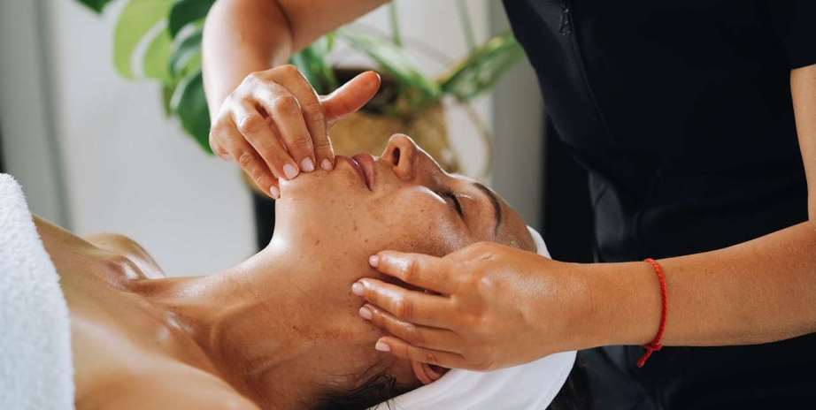 Woman having face massage