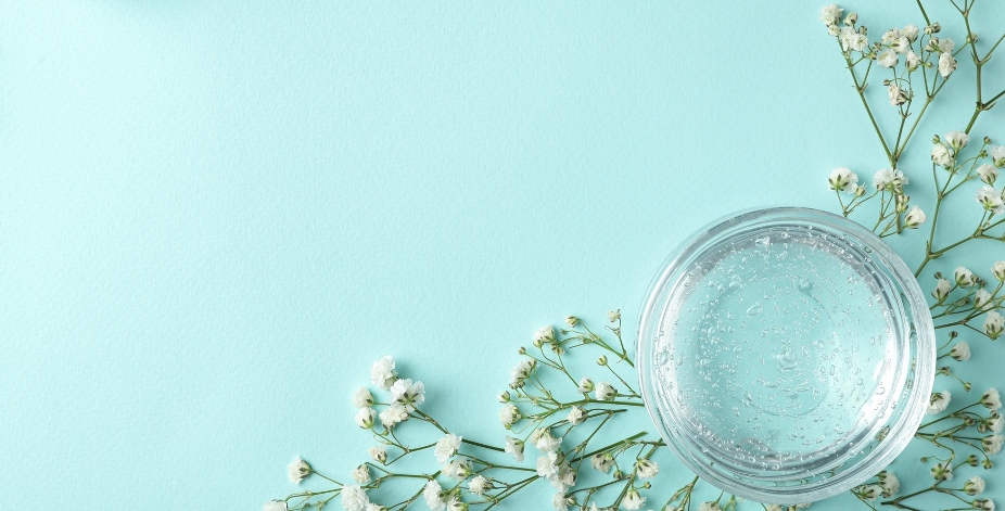 Nuru Gel in a glass pot with herbs