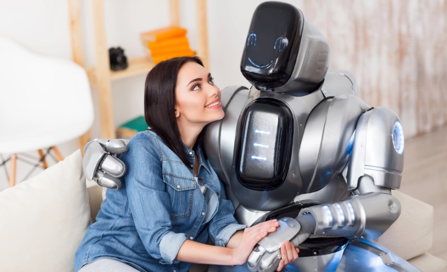 Woman with robot companion on couch