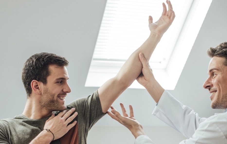 Patient exercising with physical therapist