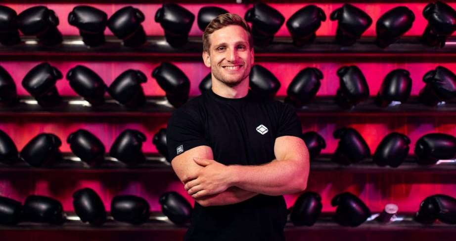 Man standing in front of boxing gloves