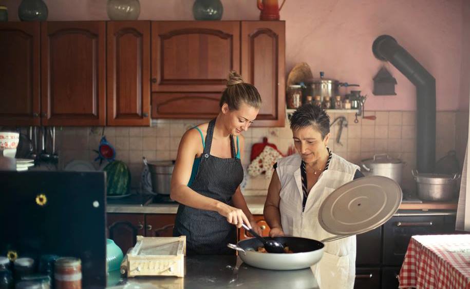 Two women preparing a meal in the kitchen