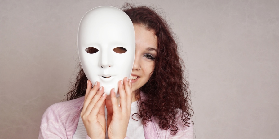 Woman taking mask off
