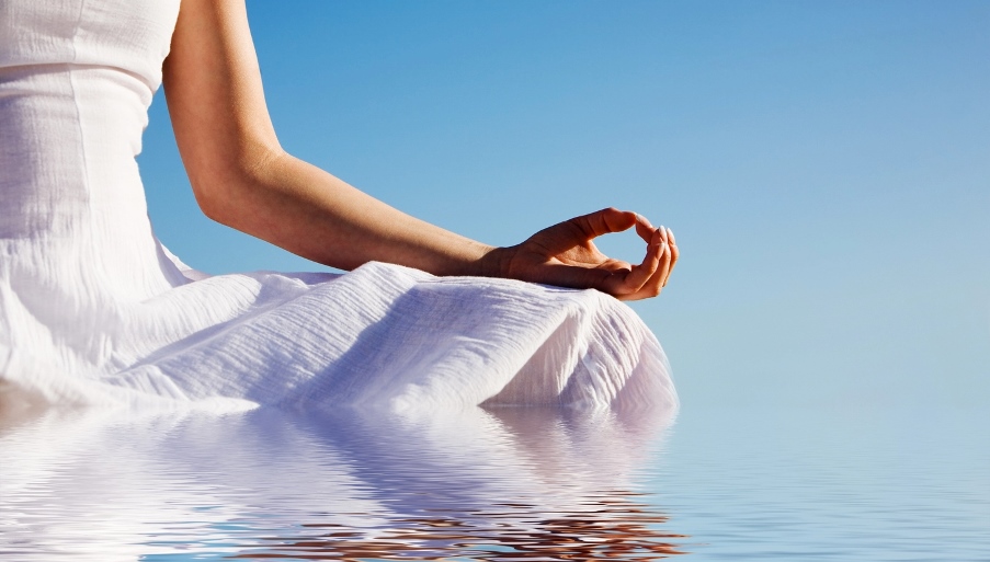 Woman meditating in water