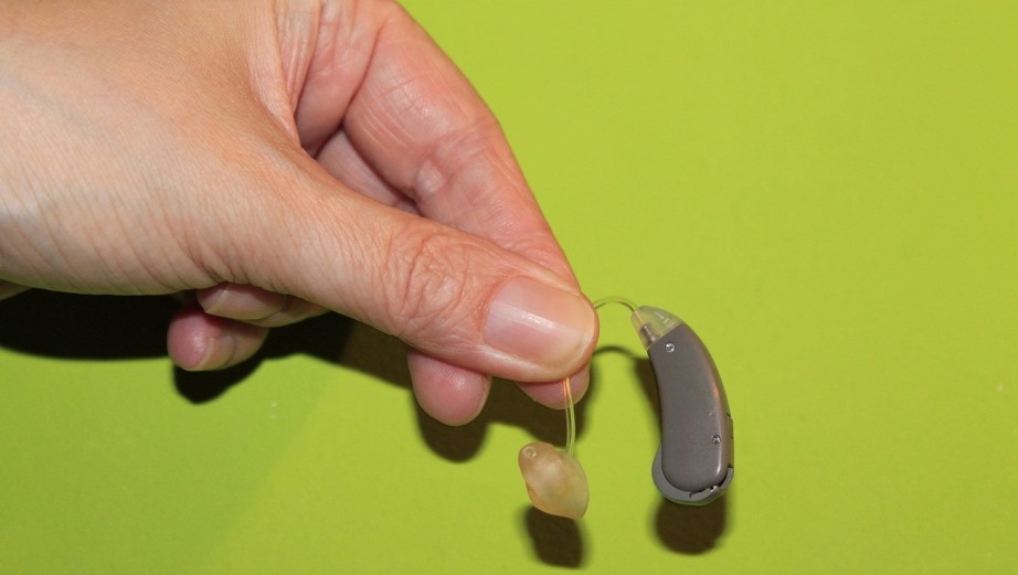 Hearing aid in hand