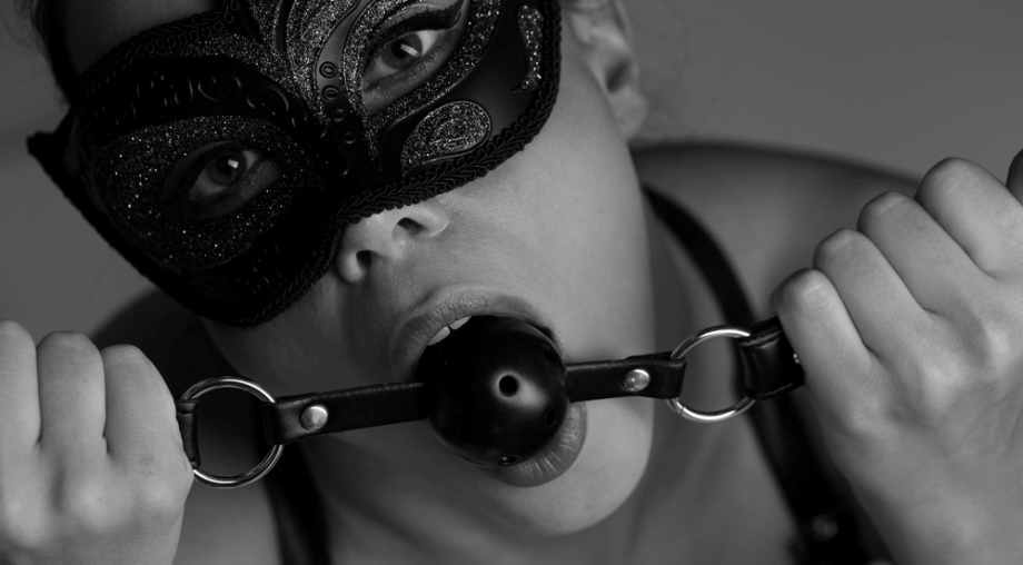 Woman with mouth gag