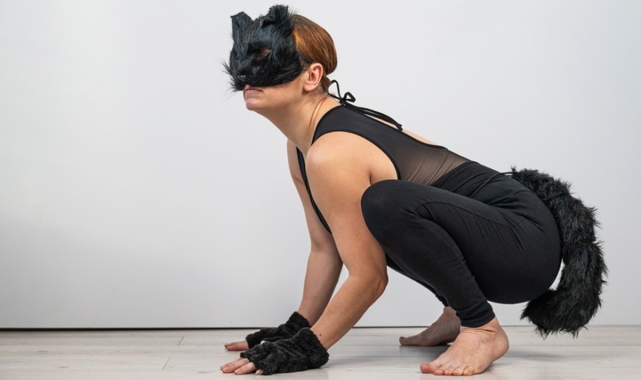 Woman enacting a cat