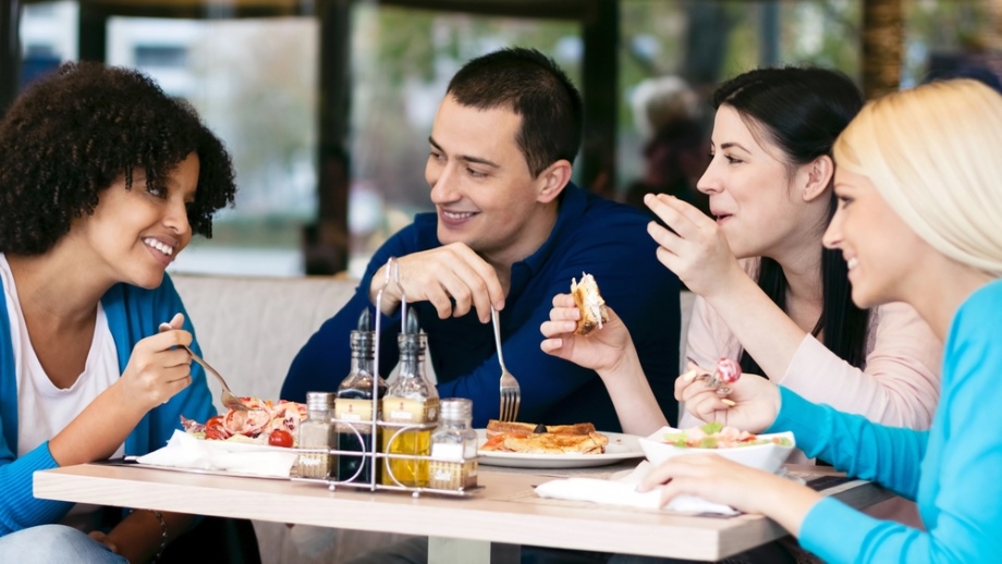 Friends eating together having fun