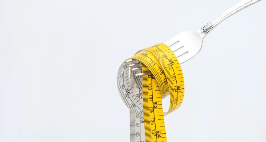 Fork with measuring tape simulating pasta