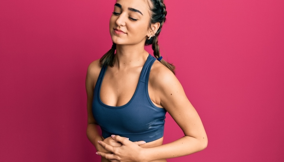 Woman feeling her belly