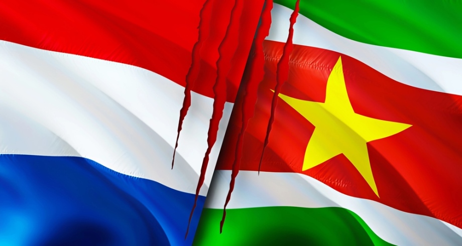 Flags from Suriname and Holland with blood and scars
