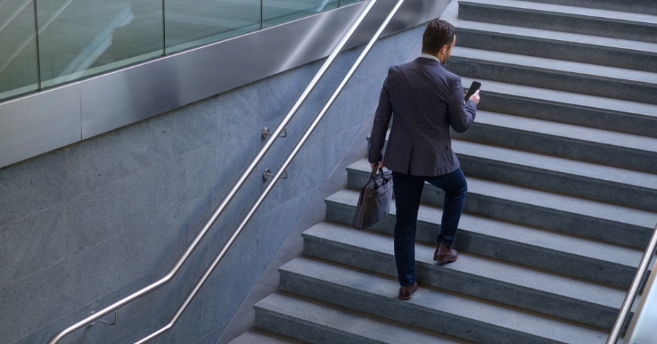 Body Awareness and Movement Attunement Business man climbing the stairs