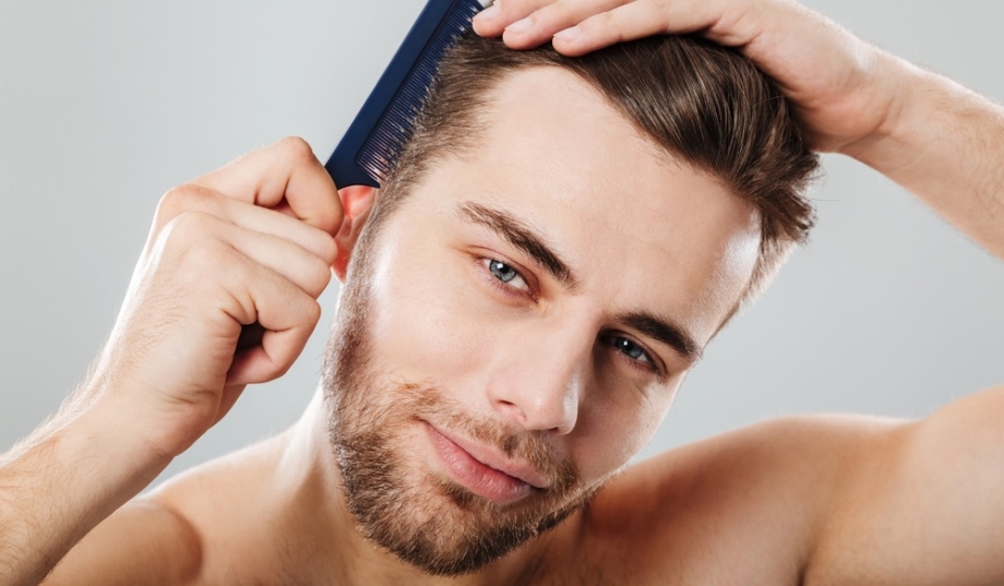 Man looksmaxxing himself