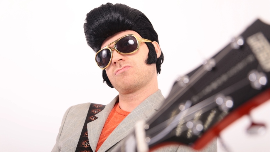 Elvis lookalike playing the guitar