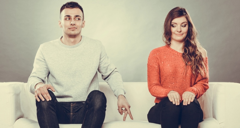 Man flirting with woman on couch