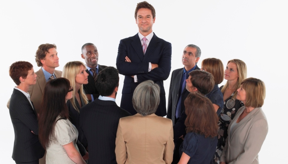Tall man standing in group of people