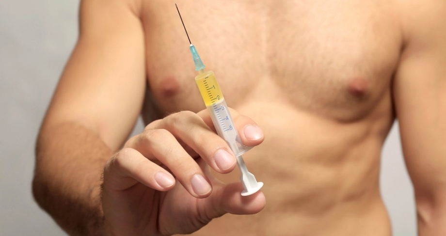 Man about to apply an anabolic steroid injection