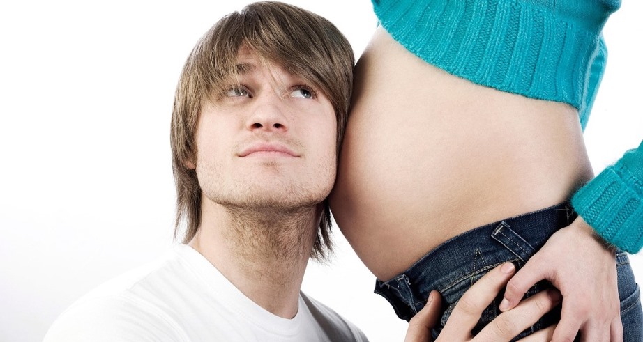 Improving Male Sexuality and Fertility Naturally Man listening to baby in his partner's belly