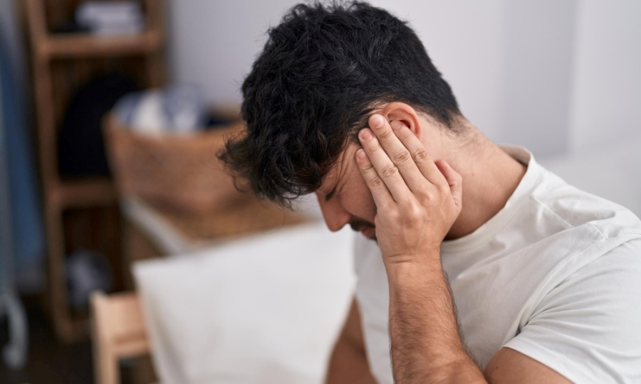 What Causes the Sound of Tinnitus? Man with tinnitus