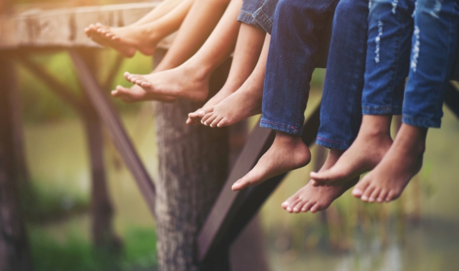 Barefoot Practices from a Cultural Perspective Children enjoying being barefoot near water
