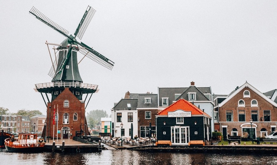 Poems About Holland Village with windmill in Holland