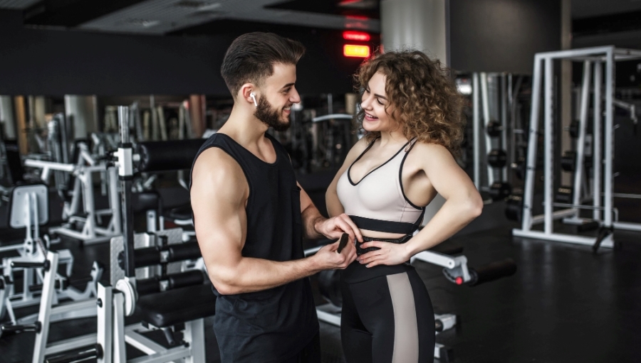 Man and woman in fitness club