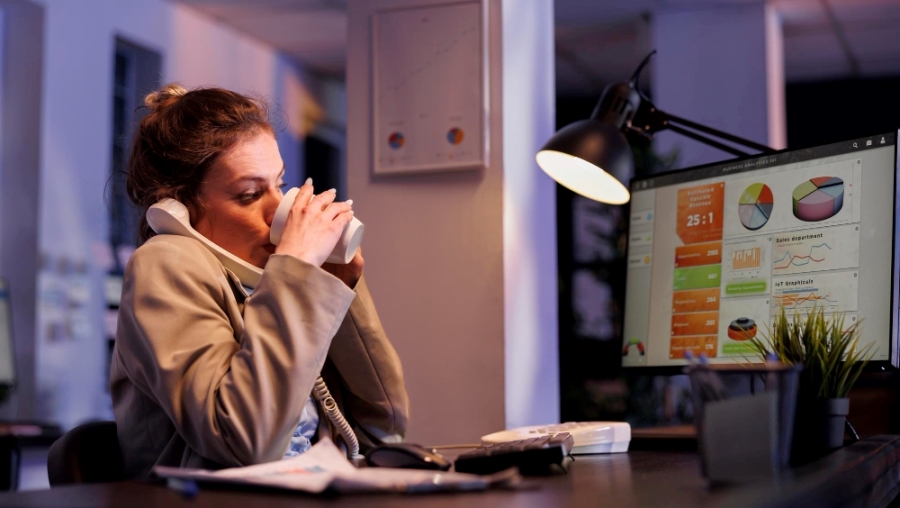 Office worker multi-tasking behind screen